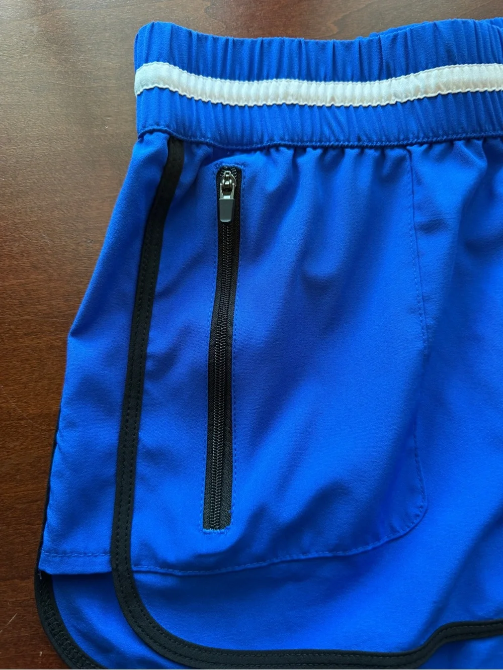 Fabletics Royal Blue Athletic Shorts with White Striped Waistband and Black Trim